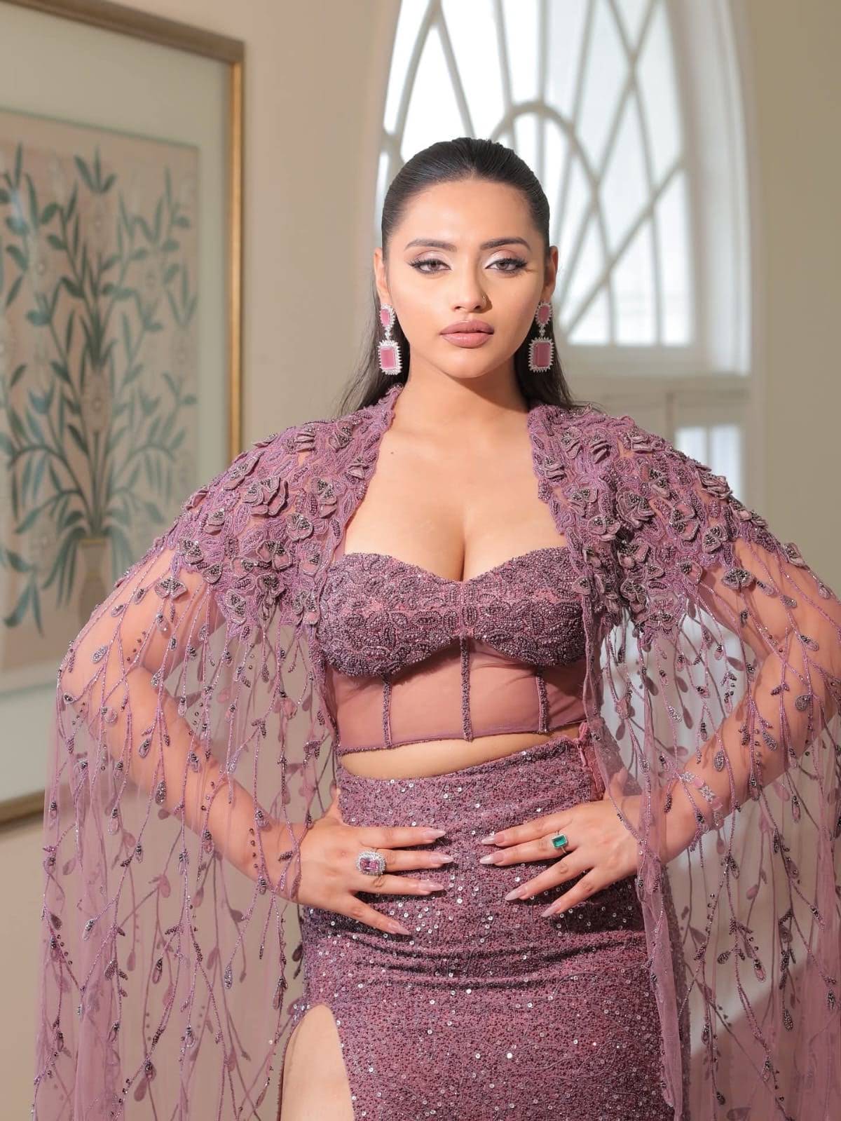Guest in a mauve occasion gown with a defined eye and glossy lip, glam by Eleglam