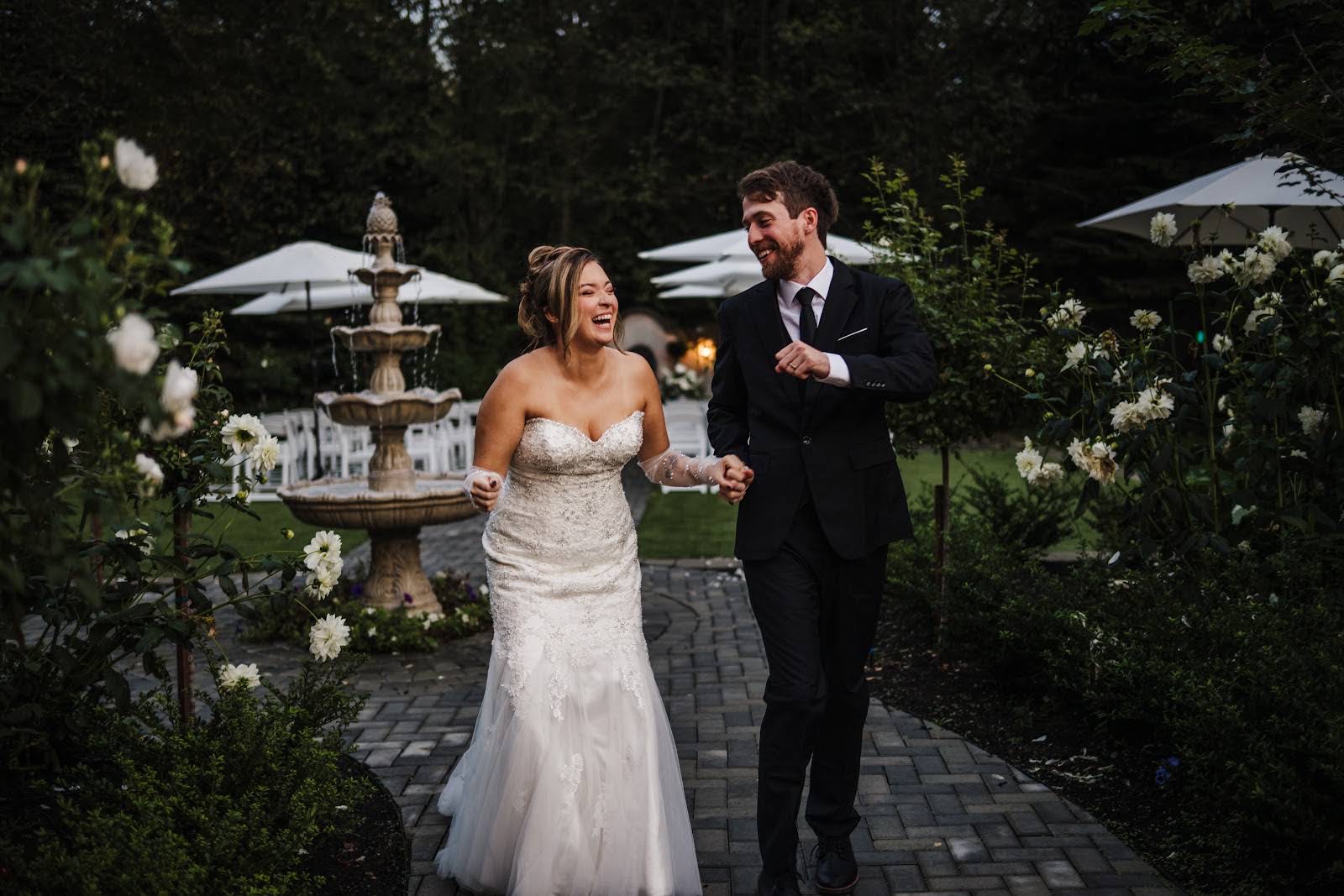 Bride and groom laughing at a Seattle garden wedding venue